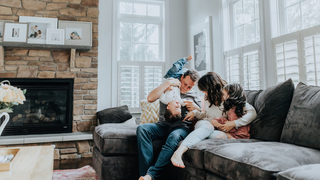 family playing on their living room couch